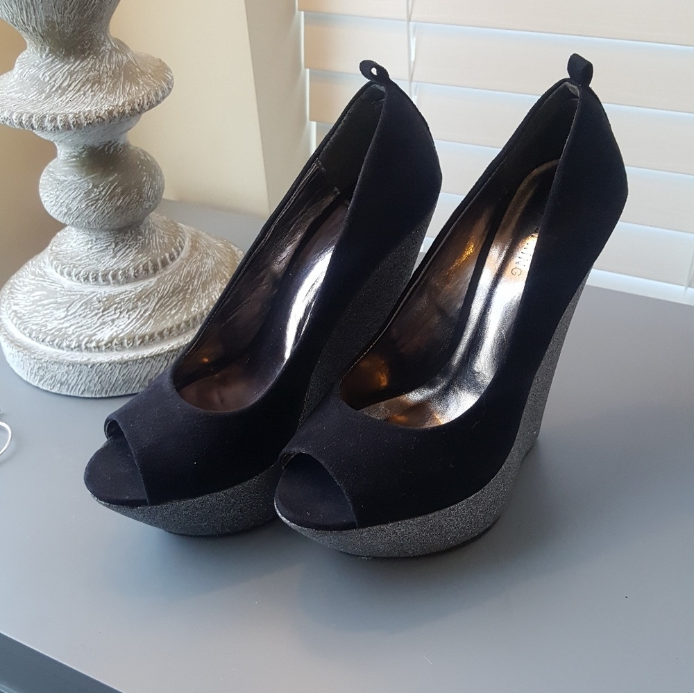 Black and sparkly silver platform heels